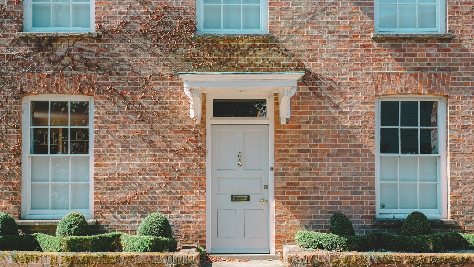 Brick house with a white front door