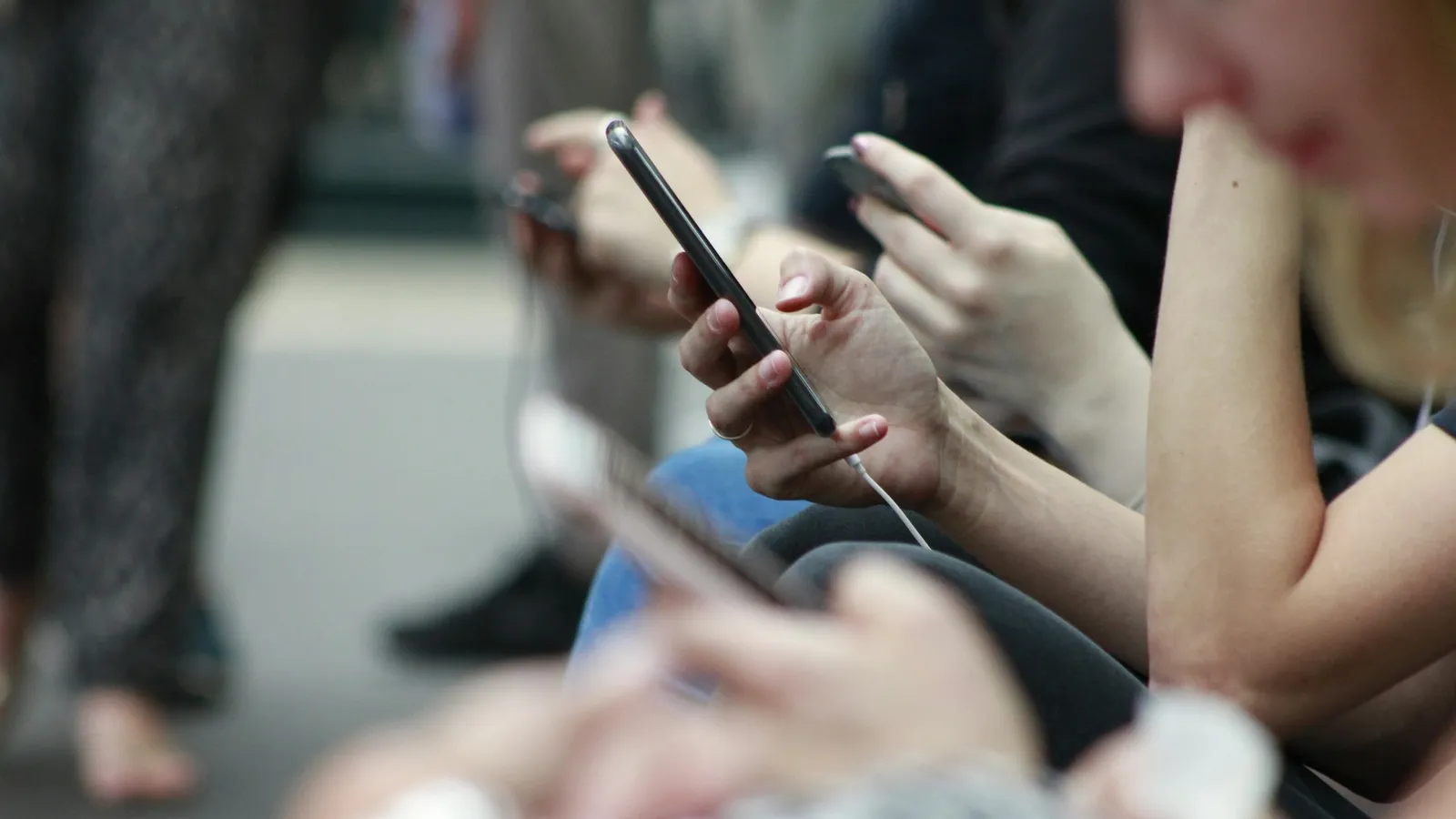 People scrolling on their phones