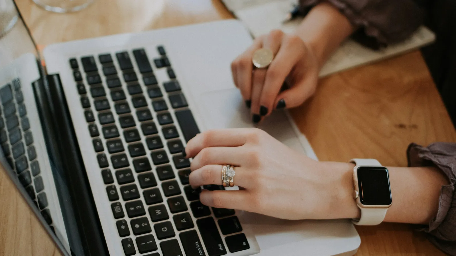 Person typing on a laptop at a desk