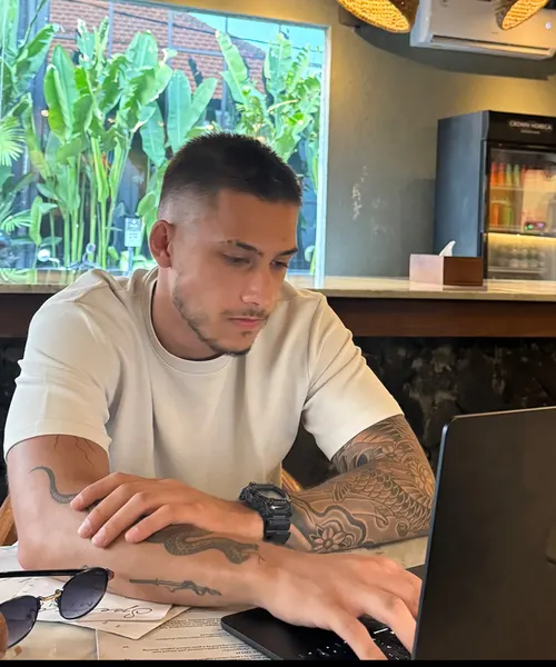 Plamen Bankov, founder of Boomtown Sites, working on a laptop